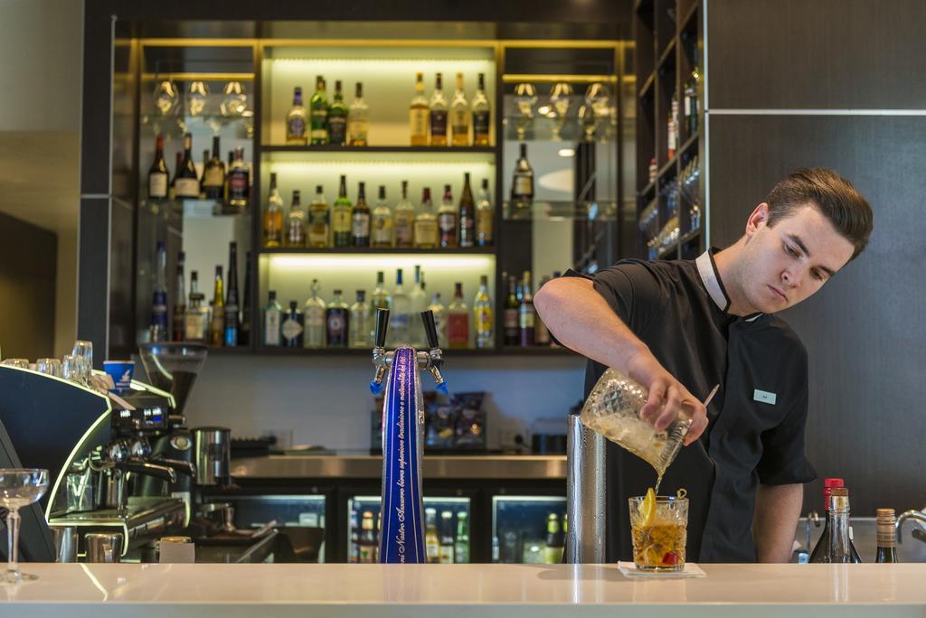 The Point Brisbane Hotel Exteriér fotografie A bartender at work